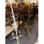 FOUR LATE 19th.C.WROUGHT IRON AND BRASS STANDARD LAMPS. (4)