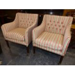 A PAIR OF REGENCY STYLE ARMCHAIRS WITH CHECKERED UPHOLSTERY AND LOOSE SEAT CUSHIONS WITH BRASS AND