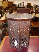 AN ANTIQUE MOORISH OCTAGONAL OCCASIONAL TABLE WITH CARVED AND INLAID DECORATION. 48 x 48 x H.63cms.
