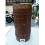 A CHINESE BAMBOO CYLINDRICAL CONTAINER SEALED WITH LEATHER, THE EXTERIOR INSCRIBED BETWEEN CARVED