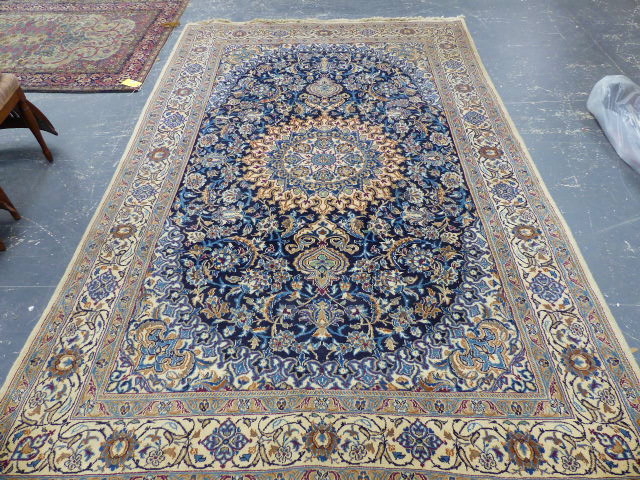 A PERSIAN CARPET OF CLASSIC DESIGN. 310 x 202cms.