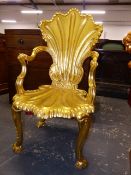 A MID 18th.C.STYLE GILTWOOD GROTTO ARMCHAIR, THE SHELL MOULDED BACK AND SEAT ON FOUR DOLPHIN LEGS.