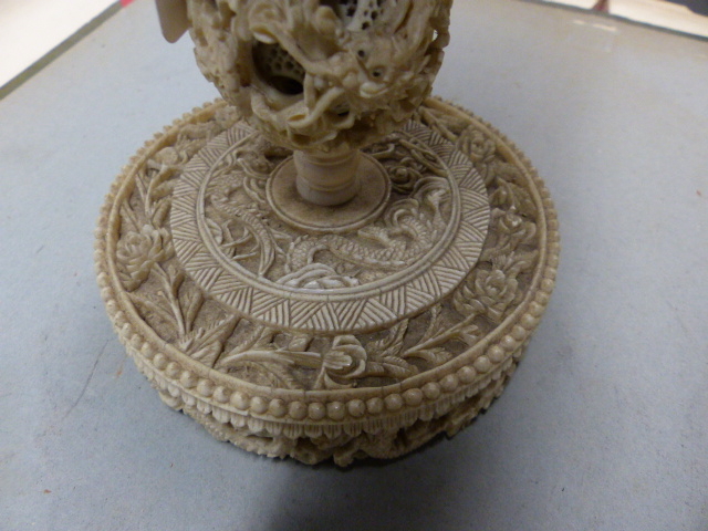 A CHINESE IVORY PUZZLE BALL CARVING WITH STAND HAVING A ROTATING RETICULATED KNOP AND A FURTHER - Image 11 of 20