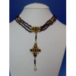 AN ITALIAN DESIGNER PERCOSSI PAPI NECKLACE VARIOUSLY SET WITH GARNETS, PEARLS AND ENAMELLED