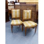 A PAIR OF FRENCH LOUIS XVI STYLE CARVED WALNUT SALON CHAIRS.