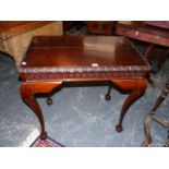 A MAHOGANY CENTRE TABLE, THE EDGE OF THE RECTANGULAR TOP CARVED WITH A BAND OF GOTHIC ARCHES