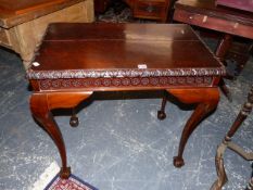 A MAHOGANY CENTRE TABLE, THE EDGE OF THE RECTANGULAR TOP CARVED WITH A BAND OF GOTHIC ARCHES