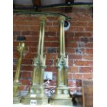 A PAIR OF NEOGOTHIC REVIVAL BRASS CLUSTER COLUMN LAMP BASES, EACH WITH TRIANGULAR ARCHED NICHES