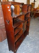 AN OAK BOOKCASE WITH SMALL CENTRAL GLAZED CABINET. 112 x 24 x H.129cms.