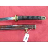 A JAPANESE OFFICER'S SWORD WITH A 67cms LONG BLADE, FULL REGULATION MILITARY MOUNTS AND CONTAINED IN