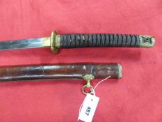 A JAPANESE OFFICER'S SWORD WITH A 67cms LONG BLADE, FULL REGULATION MILITARY MOUNTS AND CONTAINED IN