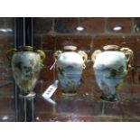HOTODA. THREE SATSUMA VASES, EACH OF THE OVOID BODIES PAINTED WITH FLOWERS AND WITH PAIRS OF GILT