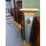 A PAIR OF MARBLE TOPPED GREY MOTTLED GREEN TAPERING SQUARE SECTIONED PEDESTALS APPLIED WITH ORMOLU