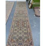 AN ORIENTAL RUNNER OF PERSIAN TABRIZ DESIGN. 353 x 79cms.