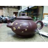 A TWO TONE YIXING TEA POT, INTERNAL STRAINER AND COVER, THE LIVER RED MELON SHAPE WITH RUSTIC