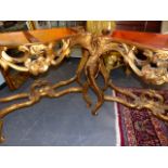 A PAIR OF LOUIS XV STYLE GILT ROUGE MARBLE TOP CONSOLE TABLES, THE SERPENTINE FOLIAGE