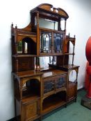 A LATE VICTORIAN BEVEL GLAZED ROSEWOOD SIDE CABINET, MIRROR BACKED SHELVES AROUND THE CUPBOARD