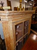 A 19th.C.COUNTRY PINE CORNER CABINET WITH GLAZED PANEL DOOR ABOVE CUPBOARD SECTION. W.78.