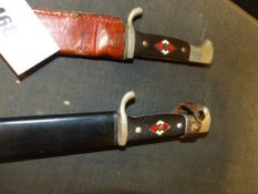 TWO HITLER YOUTH DAGGERS, ONE WITH LATER LEATHER SCABBARD.