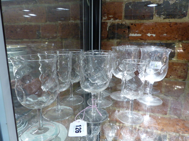 ATTRIBUTED TO JAMES POWELL, A PART SET OF DIMPLED DRINKING GLASSES, SHERRY GLASSES, RED AND WHITE