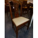 A SET OF SIX CARVED WALNUT COUNTRY GEORGIAN DINING CHAIRS WITH GOTHIC REVIVAL BACK SPLATS. (ONE