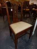 A SET OF SIX CARVED WALNUT COUNTRY GEORGIAN DINING CHAIRS WITH GOTHIC REVIVAL BACK SPLATS. (ONE