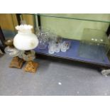 TWO OIL LAMPS, AN ANTIQUE GLASS WASP TRAP, A TALL BATTERY JAR,ETC. (QTY)