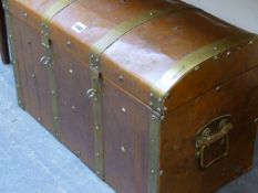 A BRASS BOUND COPPER CLAD TRUNK, THE RECTANGULAR HINGED LID WITH SHALLOW ROUND ARCHED TOP