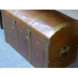 A BRASS BOUND COPPER CLAD TRUNK, THE RECTANGULAR HINGED LID WITH SHALLOW ROUND ARCHED TOP