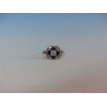 AN ANTIQUE OLD CUT DIAMOND AND ENAMEL RING, THE CENTRAL DIAMOND IS SURROUND BY FOUR TRIANGULAR