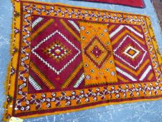 A NORTH AFRICAN TRIBAL RUG. 323 x 152cms.