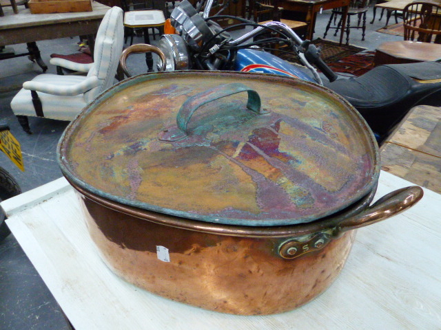 A LARGE ANTIQUE COPPER TWIN HANDLED TURBOT PAN WITH COVER.