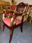A PAIR OF NEO-CLASICAL STYLE ELBOW CHAIRS, THE LEAF TOPPED ARMS RUNNING DOWN TO UPHOLSTERED SEATS