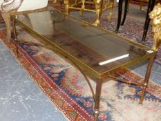 A NEAR PAIR OF BRASS FRAMED GLASS TOP COFFEE TABLES. 122 x 51 x H.41 & 121 x 46 x H.41cms