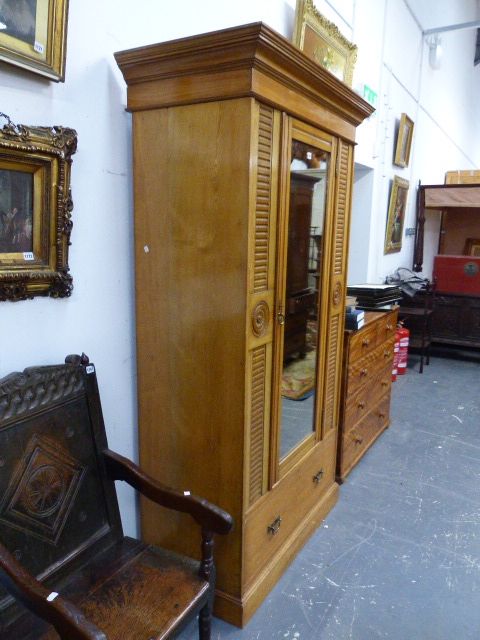 A VICTORIAN ASH WARDROBE WITH SINGLE MIRROR DOOR OVER DRAWERS AND PLINTH BASE. 106 x 59 x H.208cms. - Image 2 of 8