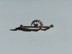 AN OLD CUT DIAMOND, SAPPHIRE AND RUBY CRESCENT MOON BAR BROOCH. WIDTH 4.5cms