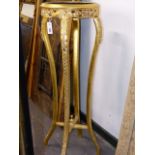 A CARVED GILTWOOD STAND, ON FOUR CABRIOLE LEGS. H.112 x Dia.39cms.