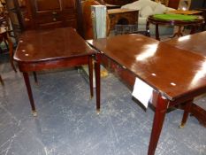 A MAHOGANY DINING TABLE WITH TWO LEAVES, THE ROUNDED RECTANGULAR ENDS EACH ON FOUR SQUARE