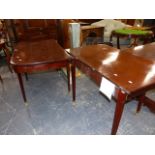 A MAHOGANY DINING TABLE WITH TWO LEAVES, THE ROUNDED RECTANGULAR ENDS EACH ON FOUR SQUARE