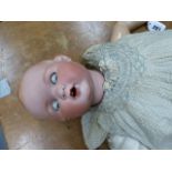 AN ARMAND MARSEILLE 518/9K BISQUE HEADED DOLL WITH SLEEPY EYES AND OPEN MOUTH. H.70cms.