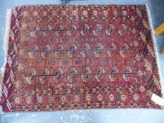 AN ANTIQUE TEKKE BOKHARA RUG. 145 x 103cms.