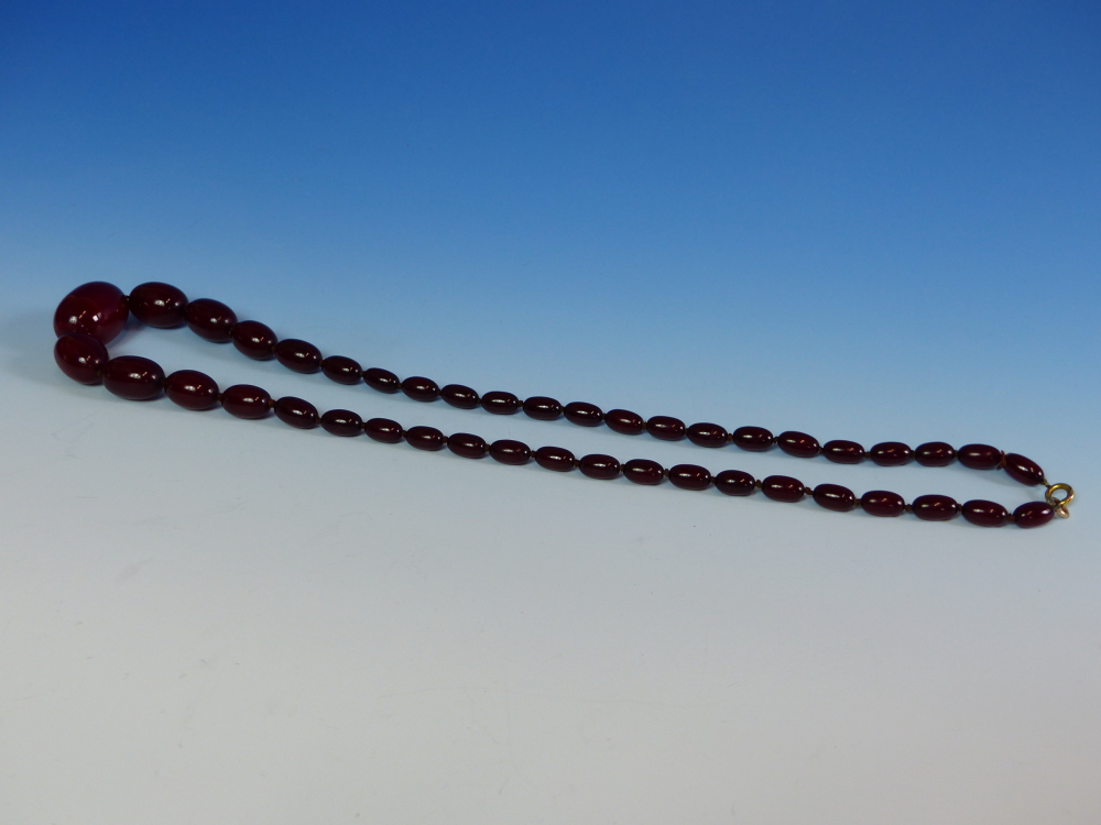 A GRADUATED ROW OF CHERRY AMBER BEADS, KNOTTED. LENGTH 76cms, WEIGHT 60 grams. - Image 9 of 21