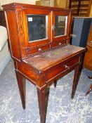A 19th.C.MAHOGANY WRITING DESK, THE MIRRORED DOORS OVER TWO DRAWERS RECESSED ABOVE A BRASS