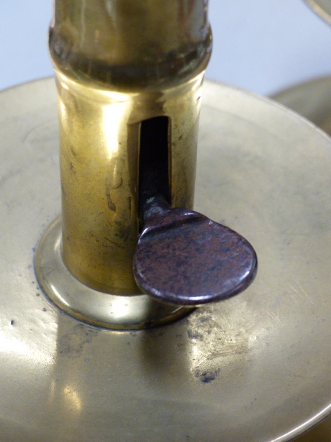 A PAIR OF 18th.C.BRASS CANDLESTICKS WITH IRON EJECTOR RODS IN THE CYLINDRICAL COLUMNS ABOVE THE WIDE - Image 12 of 19