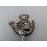A WHITE METAL CAP BADGE, POSSIBLY FOR THE LORNE RIFLES.