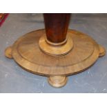 A ROSEWOOD OVAL BREAKFAST TABLE TILTING ON TAPERED CYLINDRICAL COLUMN ON PLINTH AND FOUR STEPPED