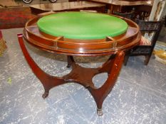 AN AMERICAN MAHOGANY CIRCULAR TABLE BY GEORGE HUNZINGER, THE TOP ROTATING BETWEEN THE FOUR CURVED