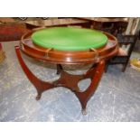 AN AMERICAN MAHOGANY CIRCULAR TABLE BY GEORGE HUNZINGER, THE TOP ROTATING BETWEEN THE FOUR CURVED