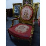 A LOUIS XVI. STYLE GILT WOOD ARMCHAIR, THE BACK AND SEAT WITH PAIRS OF FIGURES WITHIN FLORAL BORDERS