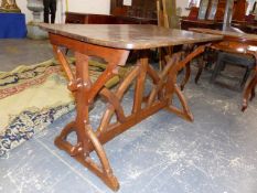 A NEOGOTHIC OAK TABLE, THE RECTANGULAR TOP ON GOTHIC ARCHED LEGS, EACH END JOINED BY CENTRAL